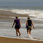 Photo of two women walking on East Beach
